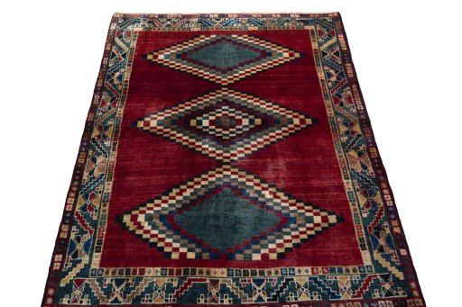 Surface texture of 2000s Persian Gabbeh rug with natural Wool and intricate pattern