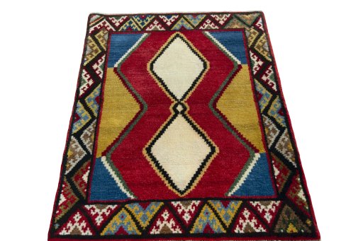 Surface texture of 2000s Persian Gabbeh rug with natural Wool and intricate pattern