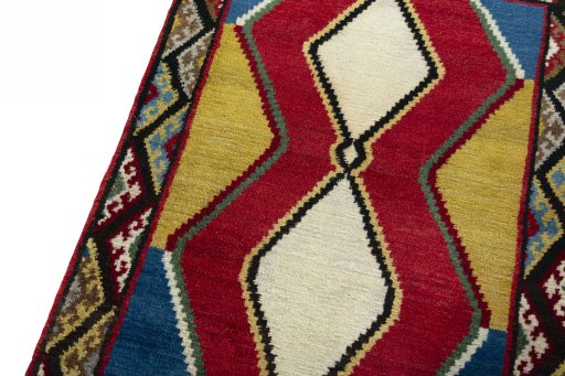 Backside of handmade 2000s Persian Gabbeh rug showing knot structure and weave density