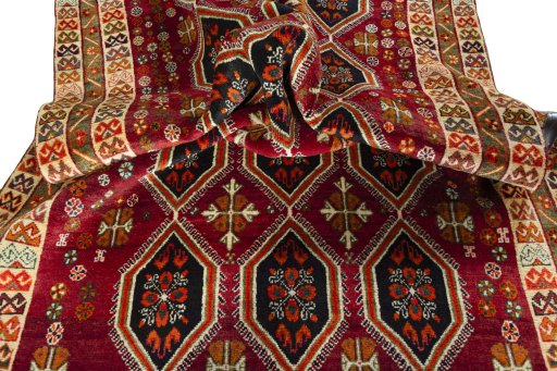 Corner detail of 2000s Persian Gabbeh rug showing border pattern and Wool pile
