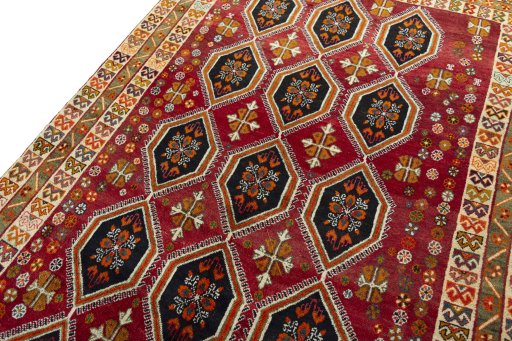 Backside of handmade 2000s Persian Gabbeh rug showing knot structure and weave density