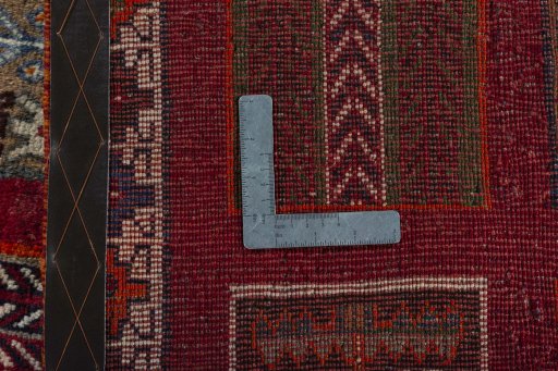 Corner detail of 2000s Persian Gabbeh rug showing border pattern and Wool pile