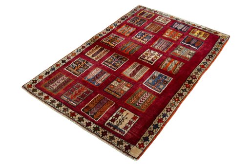 Corner detail of 2000s Persian Gabbeh rug showing border pattern and Wool pile