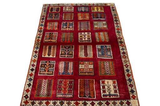 Surface texture of 2000s Persian Gabbeh rug with natural Wool and intricate pattern