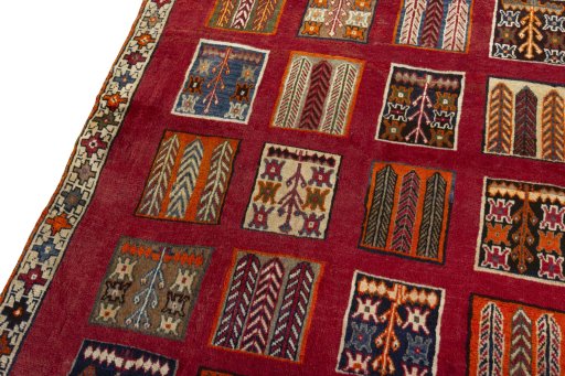 Backside of handmade 2000s Persian Gabbeh rug showing knot structure and weave density