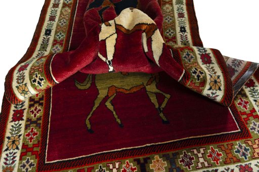 Corner detail of 2000s Persian Gabbeh rug showing border pattern and Wool pile