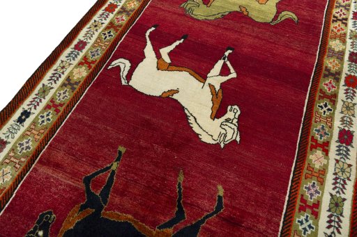 Backside of handmade 2000s Persian Gabbeh rug showing knot structure and weave density