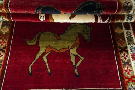 Full view of 2000s Persian Gabbeh rug from Iran / Persia, 286 × 163 cm in Red tones
