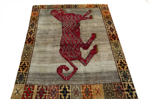 Surface texture of 2000s Persian Gabbeh rug with natural Wool and intricate pattern