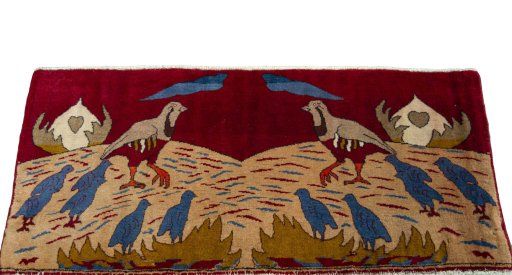 Surface texture of 2000s Persian Gabbeh rug with natural Wool and intricate pattern