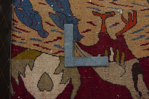 Backside of handmade 2000s Persian Gabbeh rug showing knot structure and weave density