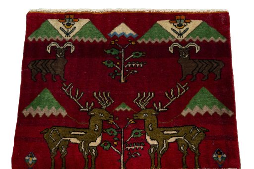 Surface texture of 2000s Persian Gabbeh rug with natural Wool and intricate pattern