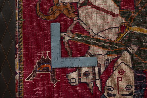 Backside of handmade 2000s Persian Gabbeh rug showing knot structure and weave density
