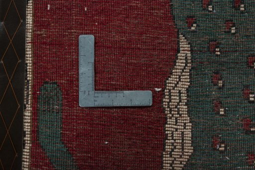 Corner detail of 2000s Persian Gabbeh rug showing border pattern and Wool pile