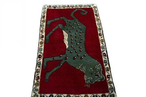 Surface texture of 2000s Persian Gabbeh rug with natural Wool and intricate pattern