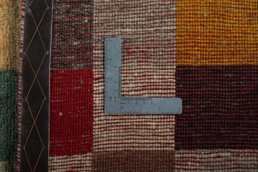 Close-up detail of 2000s Persian Gabbeh rug from Iran / Persia showing Wool weave