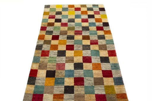 Surface texture of 2000s Persian Gabbeh rug with natural Wool and intricate pattern
