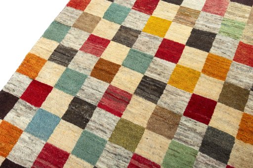 Backside of handmade 2000s Persian Gabbeh rug showing knot structure and weave density
