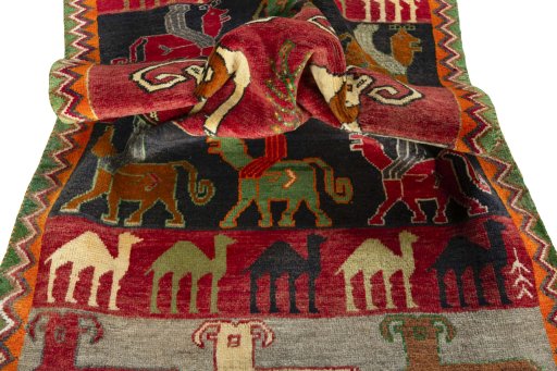 Corner detail of 2000s Persian Gabbeh rug showing border pattern and Wool pile