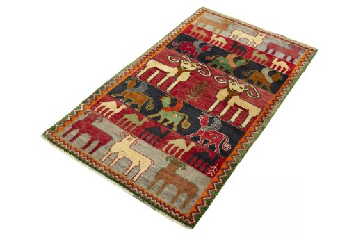 Corner detail of 2000s Persian Gabbeh rug showing border pattern and Wool pile