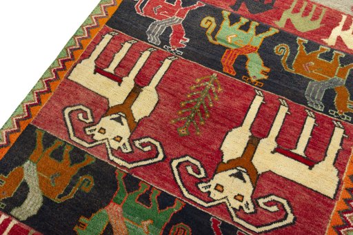 Backside of handmade 2000s Persian Gabbeh rug showing knot structure and weave density