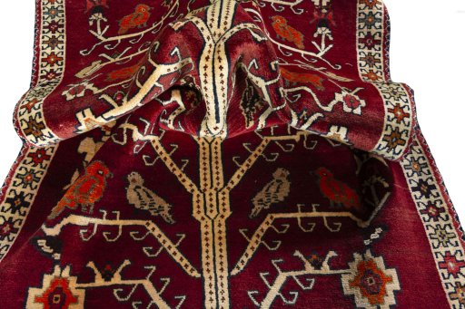 Corner detail of 2000s Persian Gabbeh rug showing border pattern and Wool pile