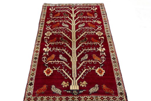 Surface texture of 2000s Persian Gabbeh rug with natural Wool and intricate pattern
