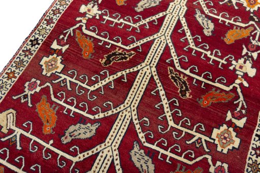 Backside of handmade 2000s Persian Gabbeh rug showing knot structure and weave density