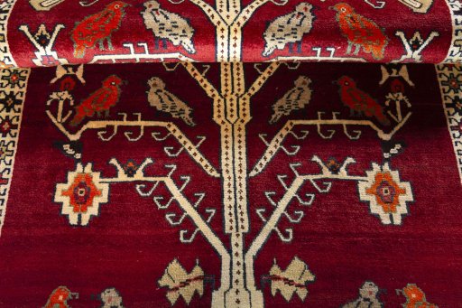 Full view of 2000s Persian Gabbeh rug from Iran / Persia, 207 × 117 cm in Red tones
