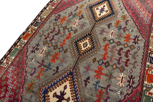 Backside of handmade 2000s Persian Gabbeh rug showing knot structure and weave density