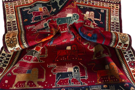 Corner detail of 2000s Persian Gabbeh rug showing border pattern and Wool pile