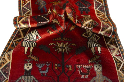 Corner detail of 2000s Persian Gabbeh rug showing border pattern and Wool pile