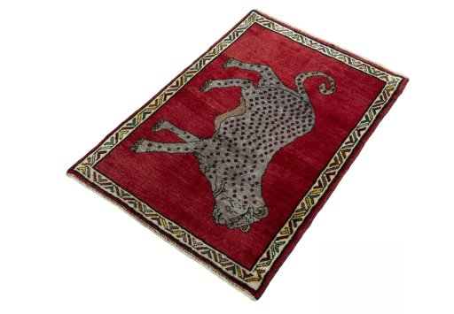 Corner detail of 2000s Persian Gabbeh rug showing border pattern and Wool pile