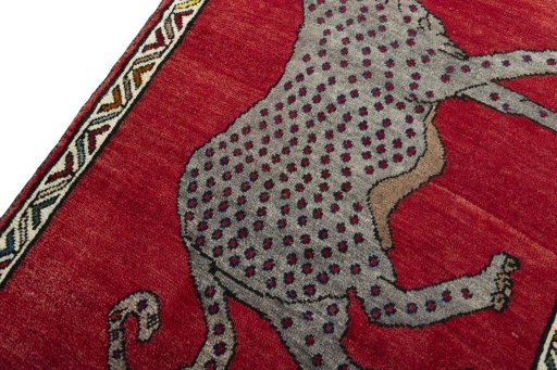 Backside of handmade 2000s Persian Gabbeh rug showing knot structure and weave density