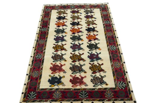 Surface texture of 2000s Persian Gabbeh rug with natural Wool and intricate pattern