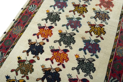 Backside of handmade 2000s Persian Gabbeh rug showing knot structure and weave density