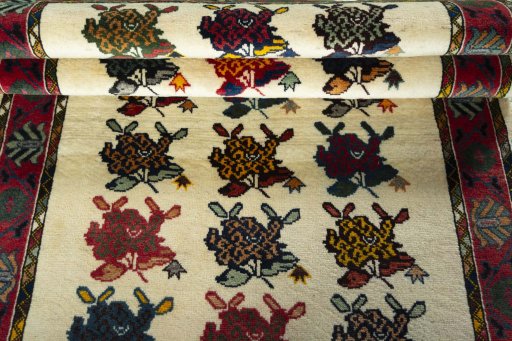 Full view of 2000s Persian Gabbeh rug from Iran / Persia, 210 × 123 cm in Beige tones