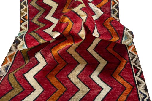 Corner detail of 2000s Persian Gabbeh rug showing border pattern and Wool pile