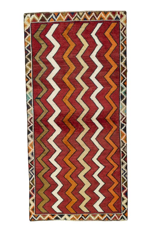 Full view of 2000s Persian Gabbeh rug from Iran / Persia, 190 × 92 cm in Red tones