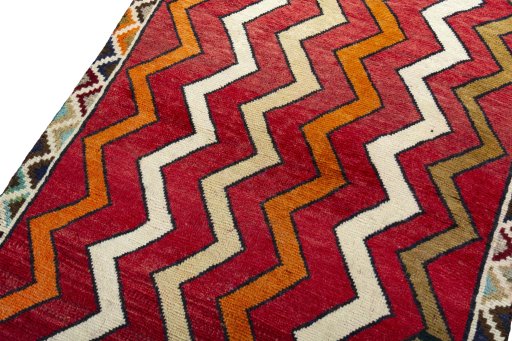 Backside of handmade 2000s Persian Gabbeh rug showing knot structure and weave density