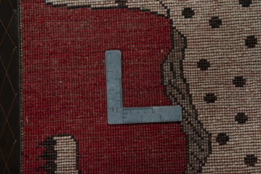 Corner detail of 2000s Persian Gabbeh rug showing border pattern and Wool pile