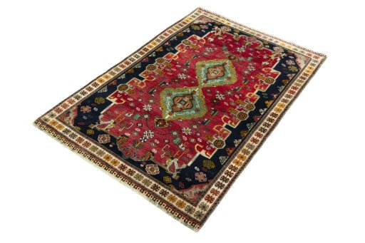 Corner detail of 2000s Persian Gabbeh rug showing border pattern and Wool pile