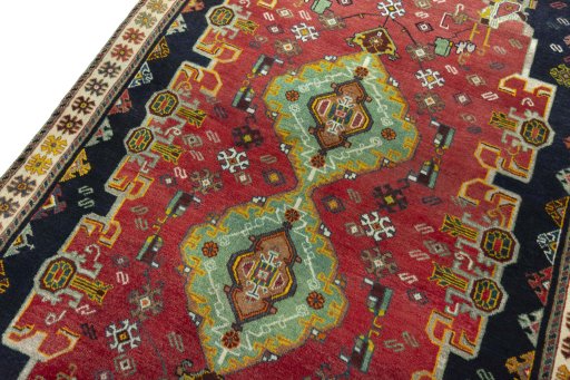 Backside of handmade 2000s Persian Gabbeh rug showing knot structure and weave density