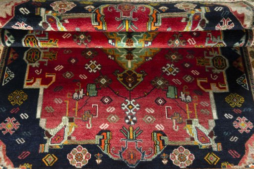Full view of 2000s Persian Gabbeh rug from Iran / Persia, 192 × 128 cm in Red tones