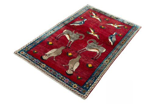 Corner detail of 2000s Persian Gabbeh rug showing border pattern and Wool pile