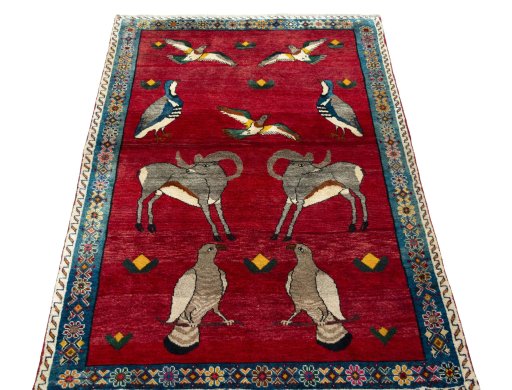 Surface texture of 2000s Persian Gabbeh rug with natural Wool and intricate pattern