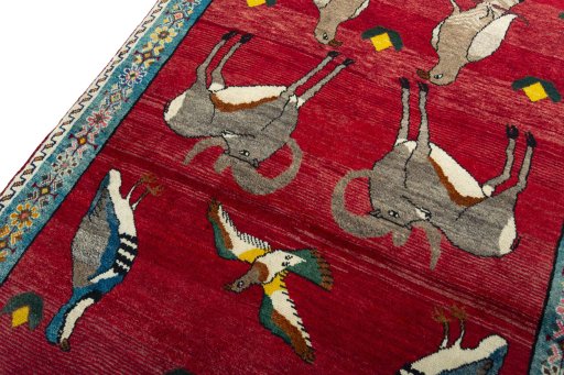 Backside of handmade 2000s Persian Gabbeh rug showing knot structure and weave density