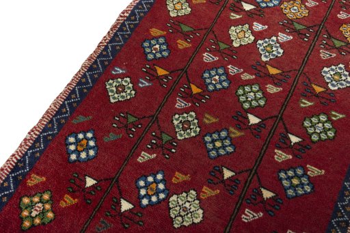 Backside of handmade 2000s Persian Gabbeh rug showing knot structure and weave density