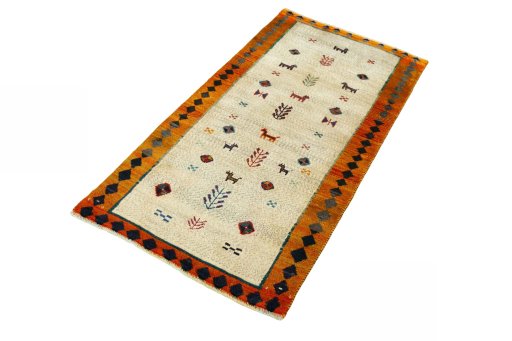 Corner detail of 2000s Persian Gabbeh rug showing border pattern and Wool pile