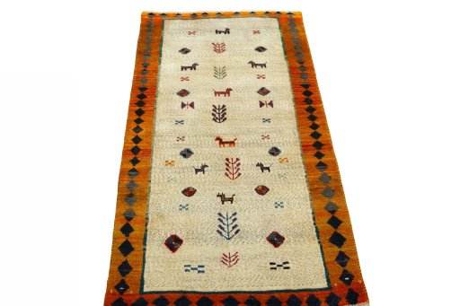 Surface texture of 2000s Persian Gabbeh rug with natural Wool and intricate pattern